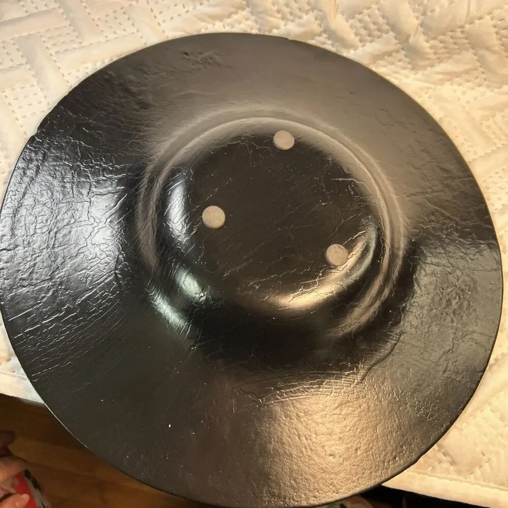 Glass bowl features an asymmetrical shape with a striking black and gold crackle